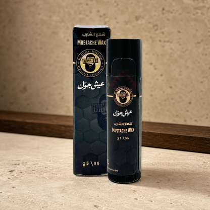 Diggn'It Natural Mustache Wax 5 g stick and carton on a warm mineral surface