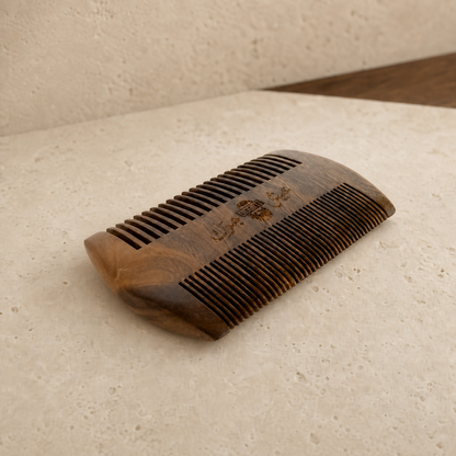 Diggn'It Sandalwood Beard Comb on a warm pale-mineral surface