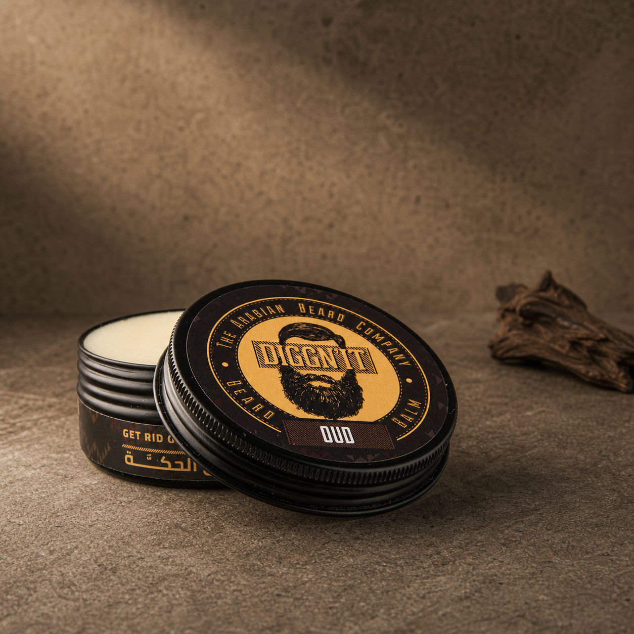 Diggn'It Oud Arabian Beard Balm open tin beside dark aged wood