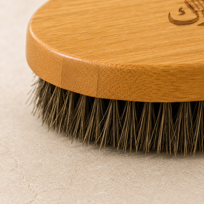 Close view of bamboo grain and natural horse-hair bristles on the Diggn'It Bamboo Beard Brush
