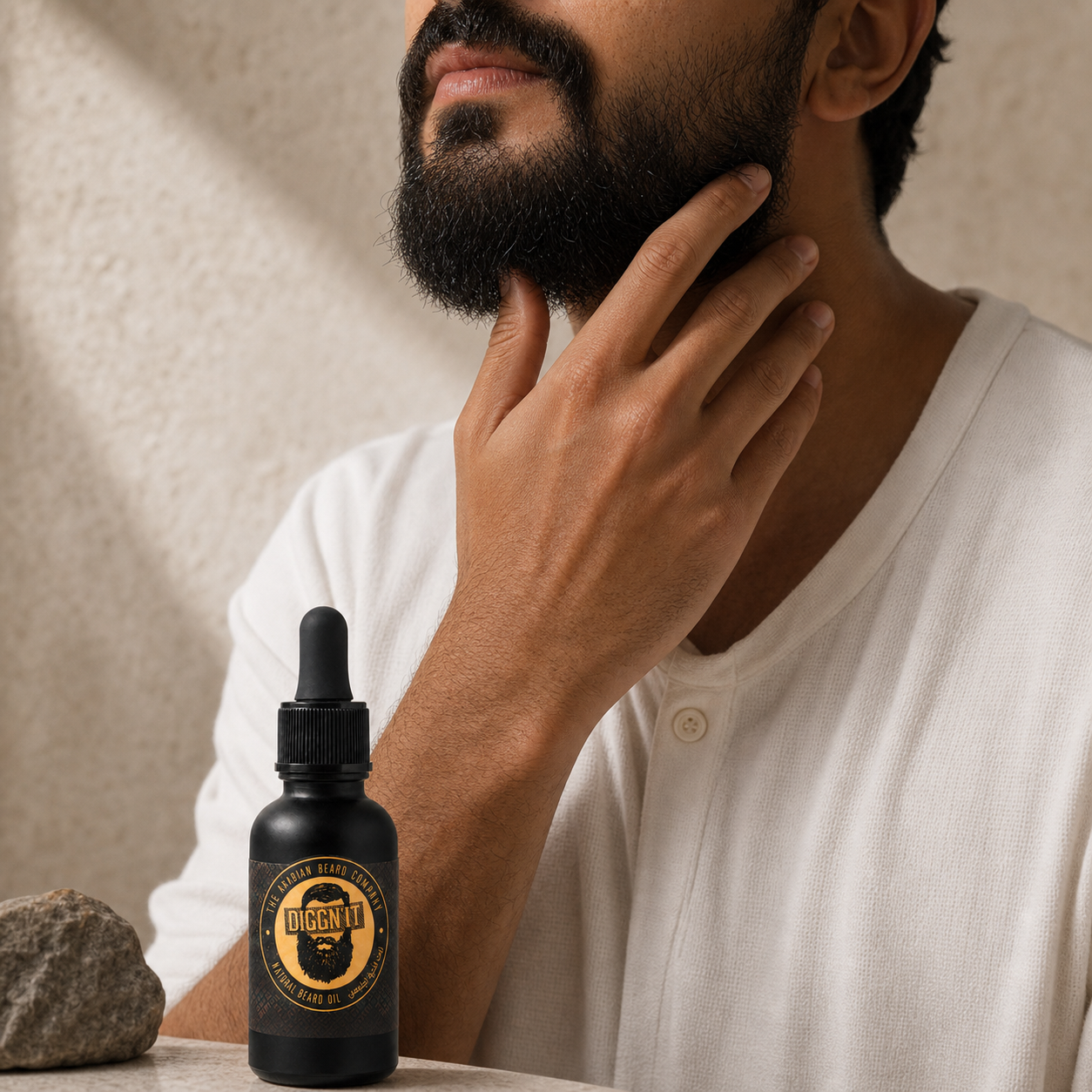 Man applying Diggn'It Arabian Beard Oil to his beard