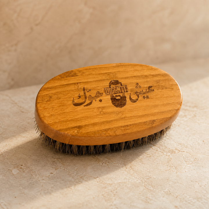 Diggn'It Bamboo Beard Brush on a warm ivory mineral surface